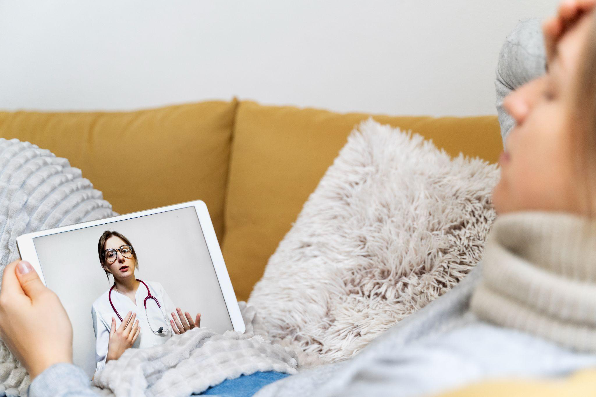 A doctor and client on video call 