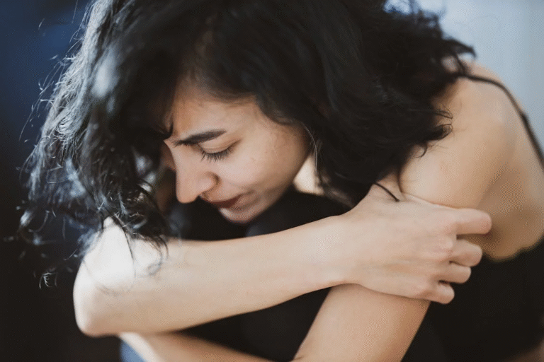 A woman feeling overwhelmed by emotions